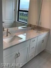 a kitchen with a sink and a window