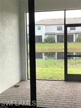 a view of a swimming pool with outdoor seating and plants