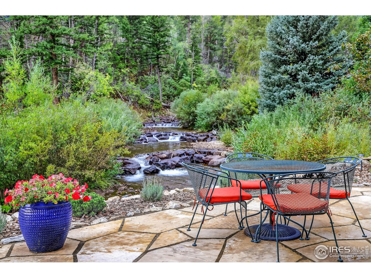 175 Main Street Jamestown, CO 80455 - Photo 1 of 44 a view of a chairs and table in a backyard