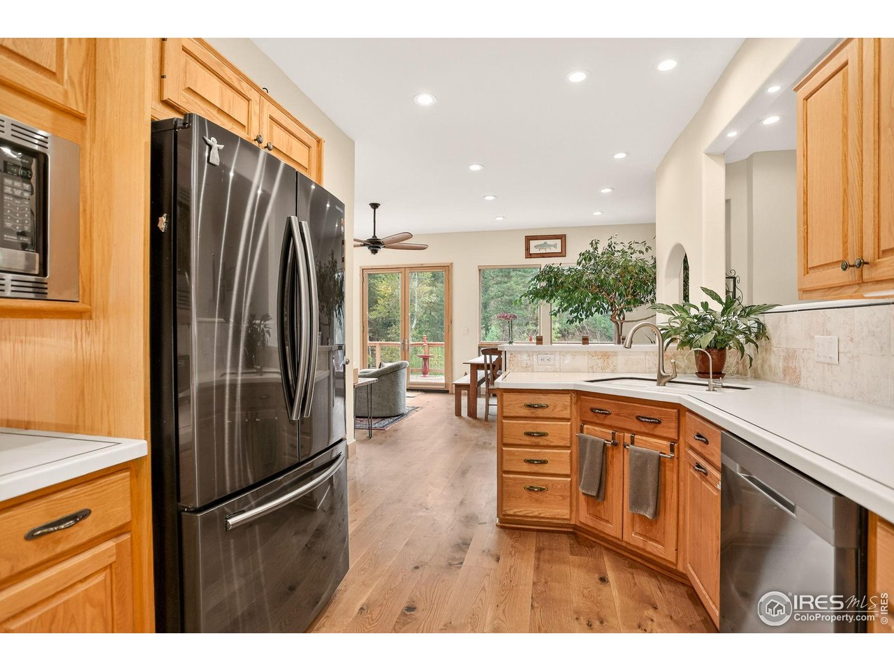 175 Main Street Jamestown, CO 80455 - Photo 11 of 44 a kitchen with stainless steel appliances granite countertop a refrigerator and a sink