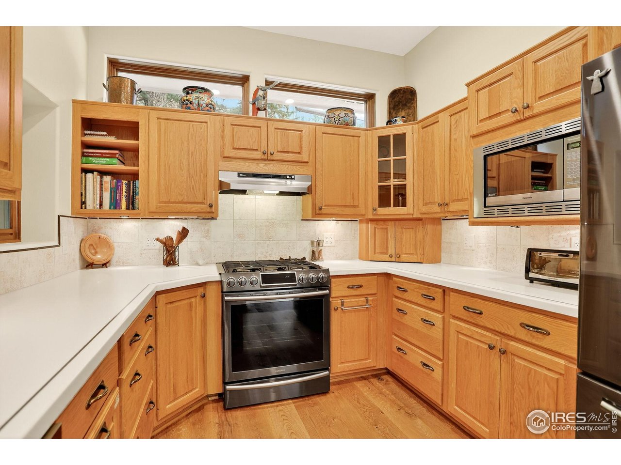 175 Main Street Jamestown, CO 80455 - Photo 13 of 44 a kitchen with stainless steel appliances granite countertop a stove and cabinets