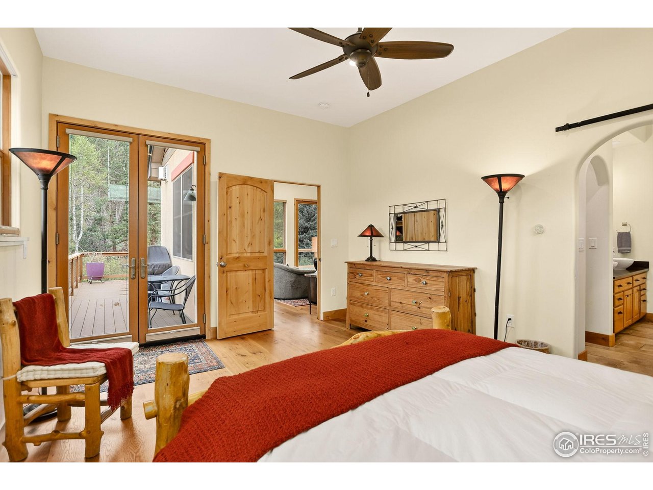 175 Main Street Jamestown, CO 80455 - Photo 15 of 44 a bedroom with a bed and wooden floor