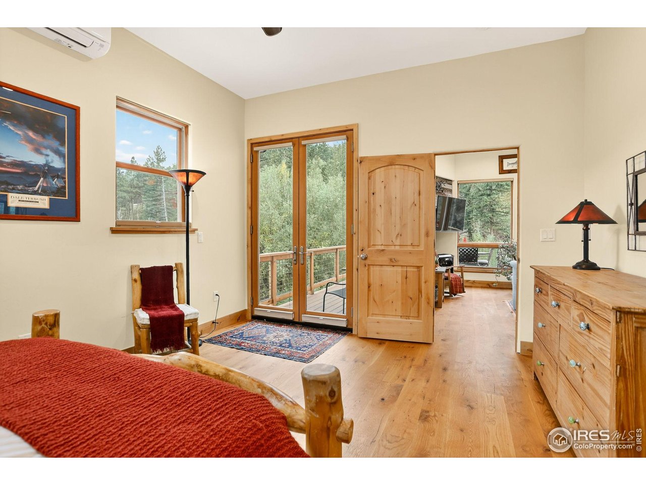 175 Main Street Jamestown, CO 80455 - Photo 17 of 44 a bedroom with a balcony a bed and a large window