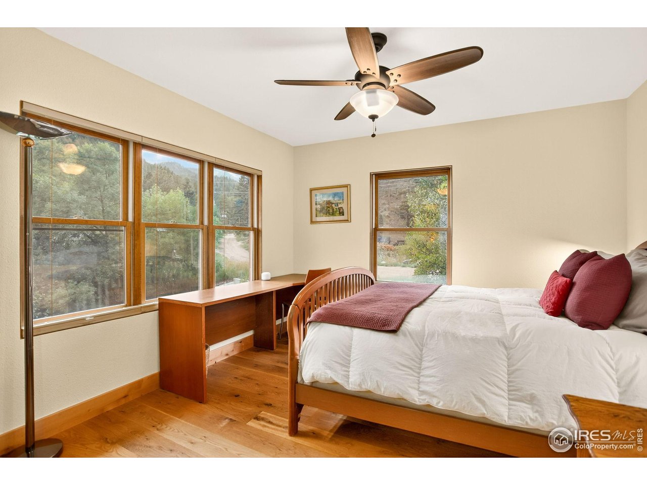 175 Main Street Jamestown, CO 80455 - Photo 20 of 44 a bedroom with a large bed and a large window