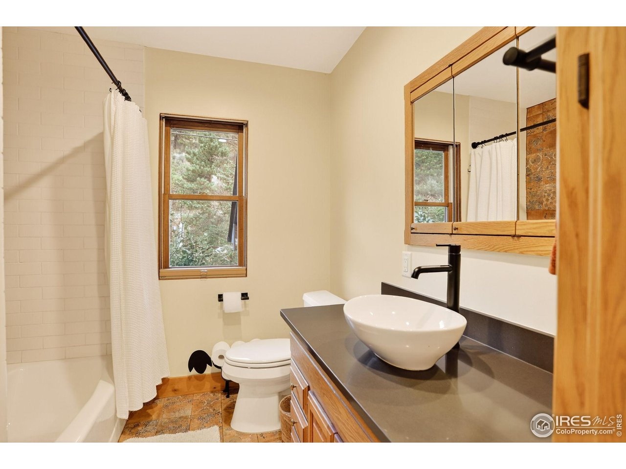 175 Main Street Jamestown, CO 80455 - Photo 21 of 44 a bathroom with a sink toilet a mirror and shower