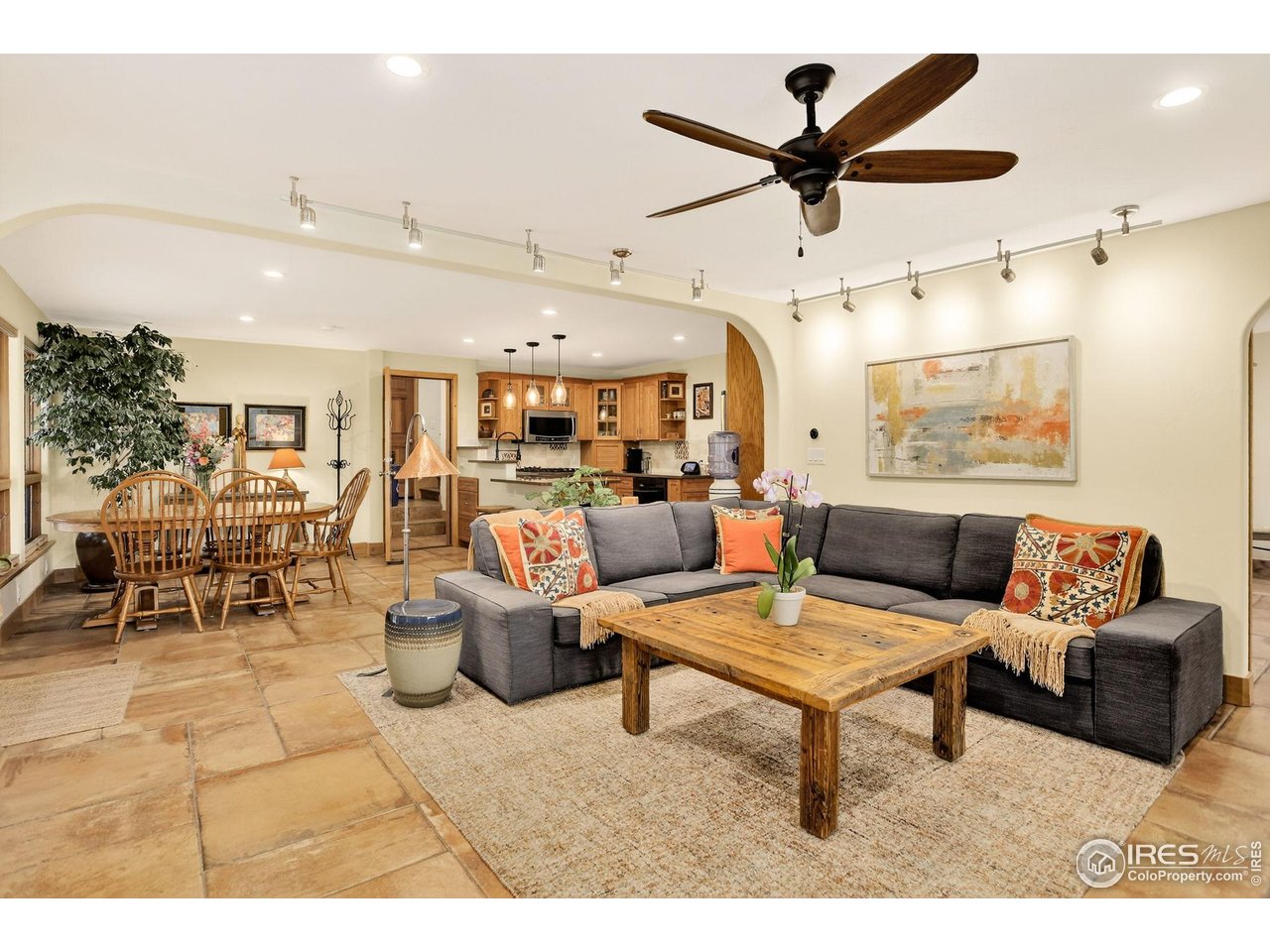 175 Main Street Jamestown, CO 80455 - Photo 24 of 44 a living room with lots of furniture and a ceiling fan