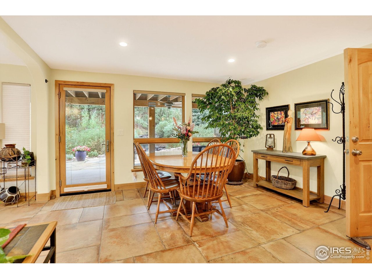 175 Main Street Jamestown, CO 80455 - Photo 27 of 44 a dining room with furniture and a floor to ceiling window