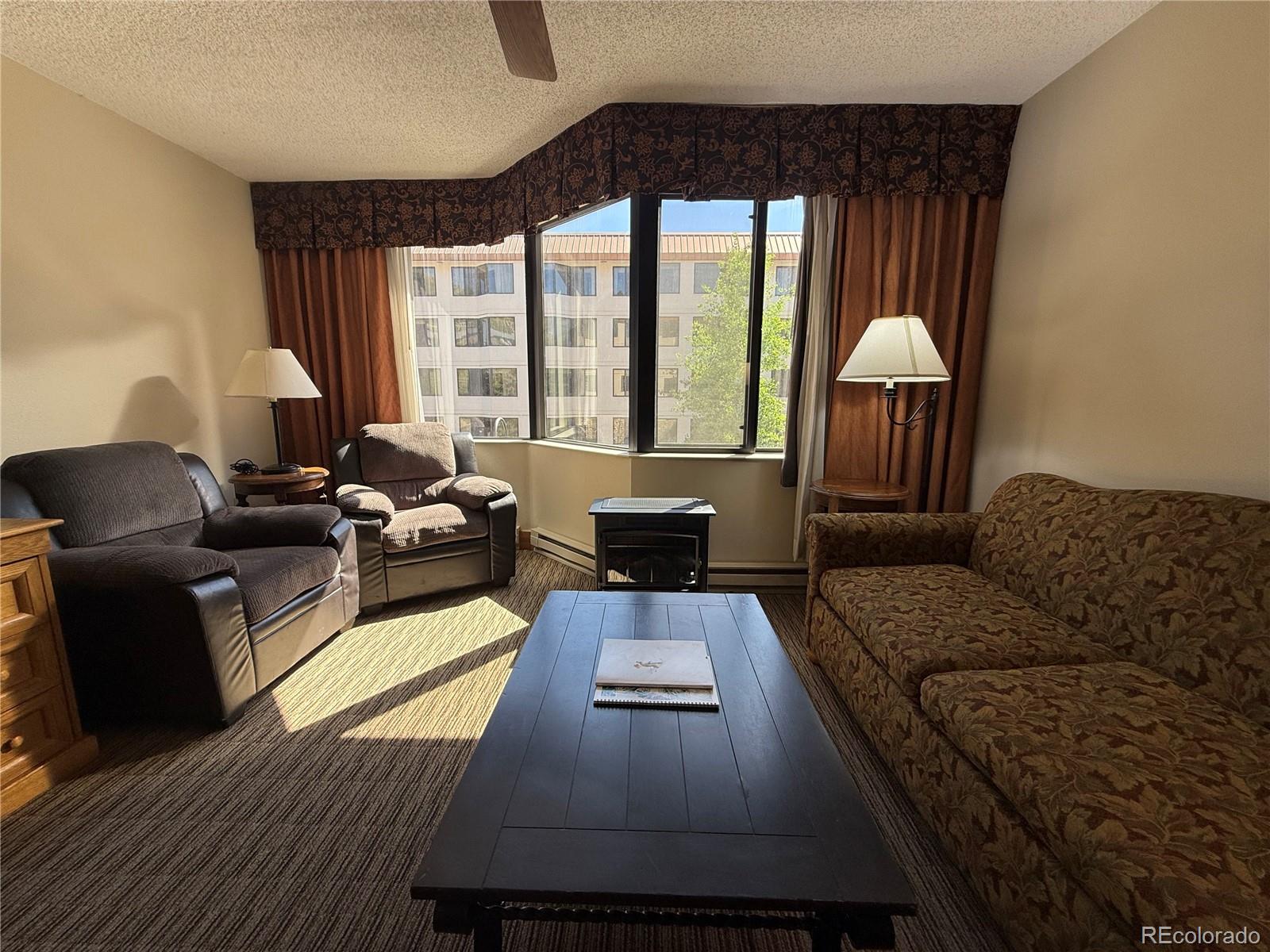 6 Emmons Road, Unit 379/381 Crested Butte, CO 81225 - Photo 17 of 34 a living room with furniture and a large window