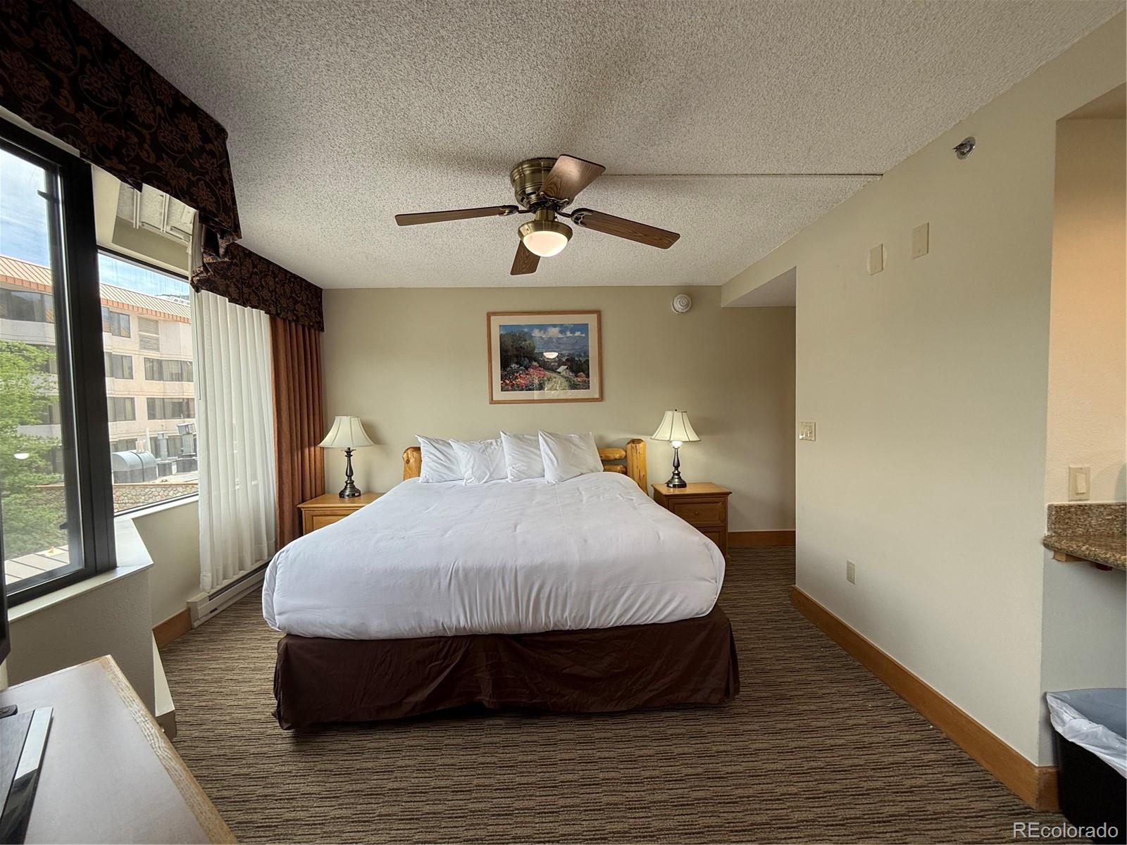 6 Emmons Road, Unit 379/381 Crested Butte, CO 81225 - Photo 21 of 34 a bed sitting in a bedroom next to a window