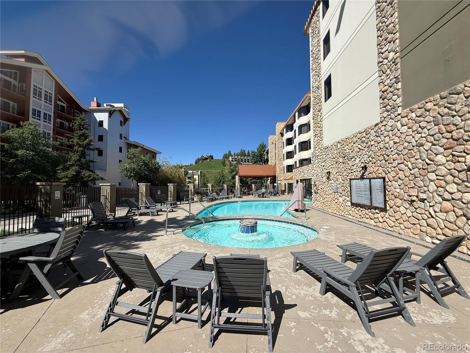 6 Emmons Road, Unit 379/381 Crested Butte, CO 81225 - Photo 26 of 34 a backyard of a house with outdoor seating