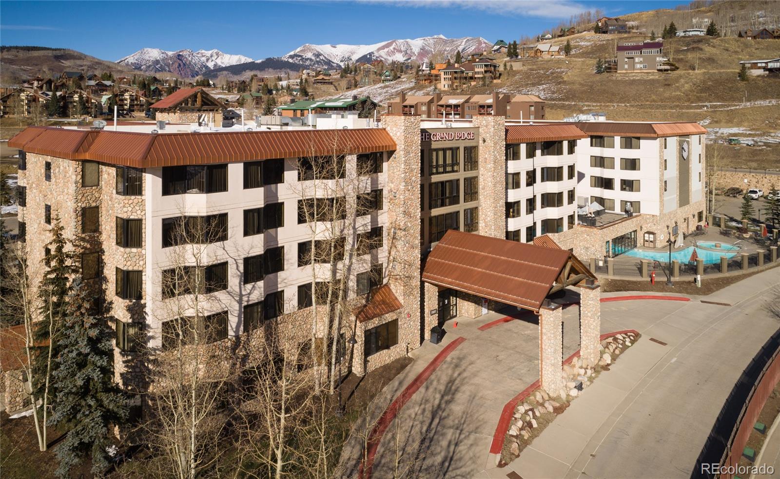 6 Emmons Road, Unit 379/381 Crested Butte, CO 81225 - Photo 29 of 34 a view of a balcony with chairs and a potted plant