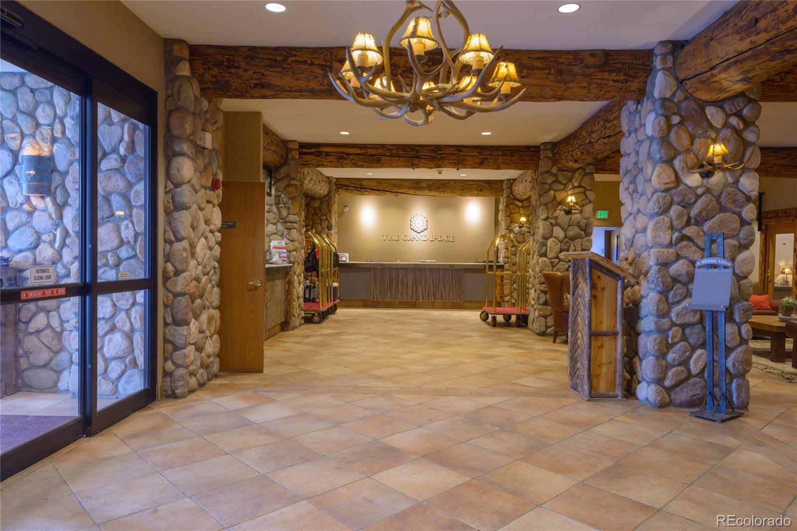 6 Emmons Road, Unit 379/381 Crested Butte, CO 81225 - Photo 32 of 34 a view of an empty room with a chandelier