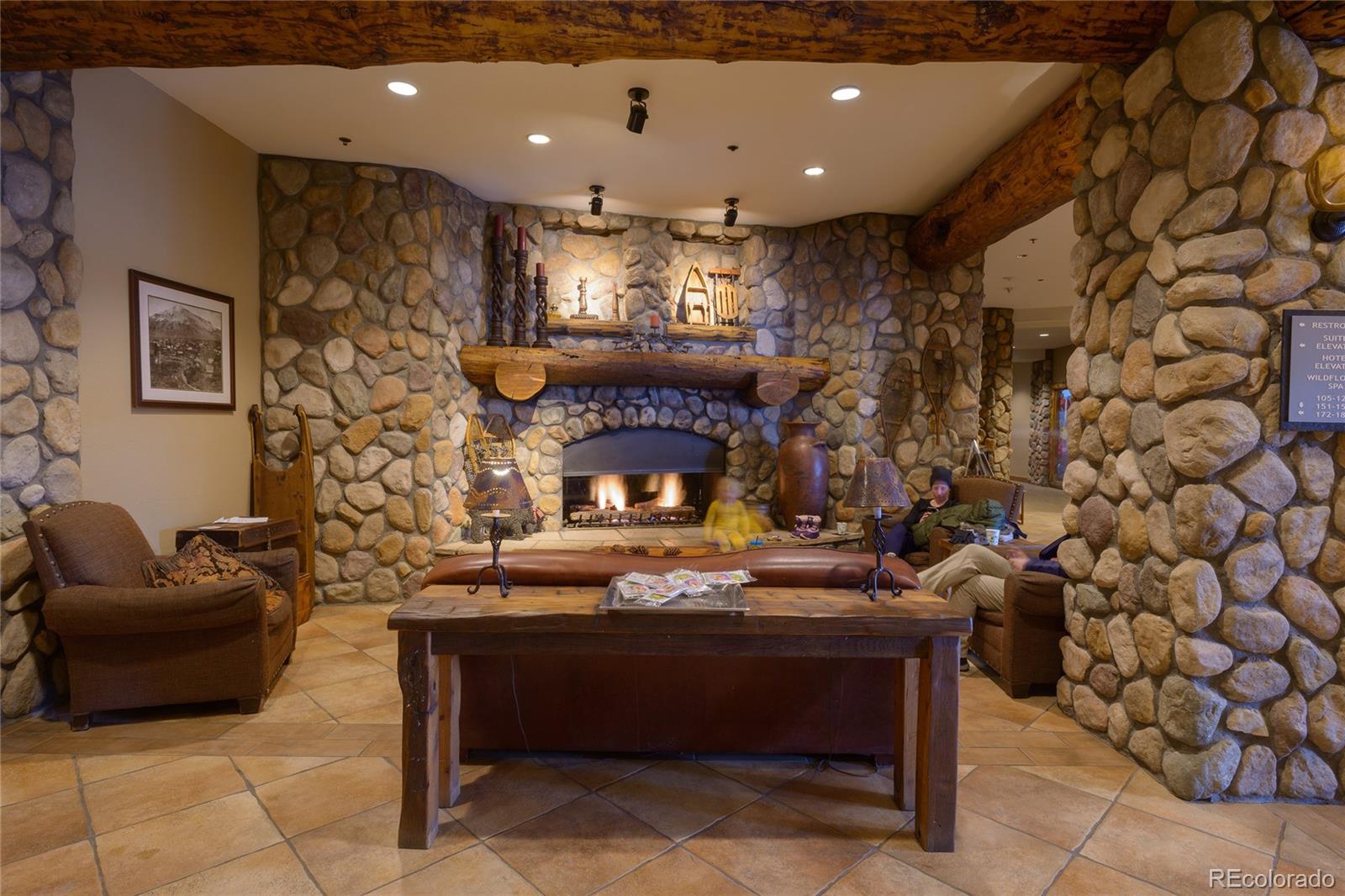 6 Emmons Road, Unit 379/381 Crested Butte, CO 81225 - Photo 33 of 34 a living room with furniture and a fireplace