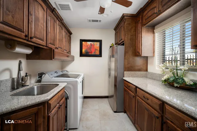 a bedroom with a bed and a ceiling fan