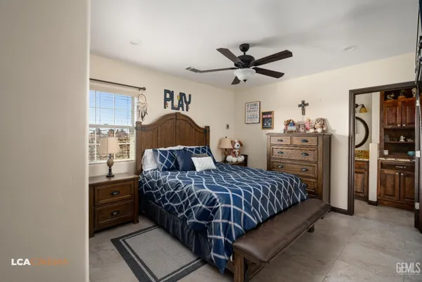 a bathroom with a toilet a sink and a mirror