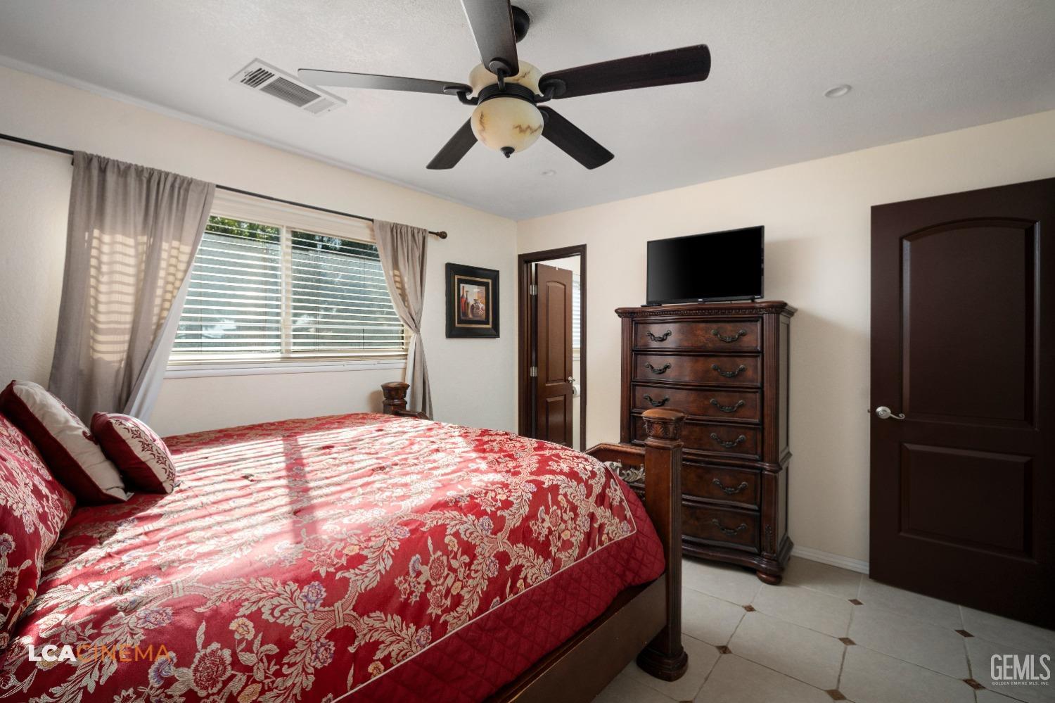 Undisclosed Address Pixley, CA 93256 - Photo 32 of 45 a bedroom with a bed and a television