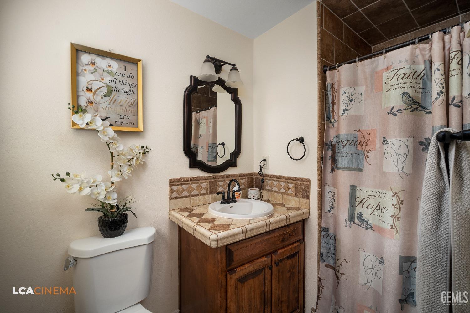 Undisclosed Address Pixley, CA 93256 - Photo 33 of 45 a bathroom with a sink toilet and shower