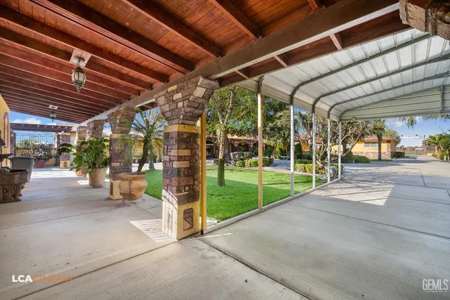 a front view of a house with yard and green space
