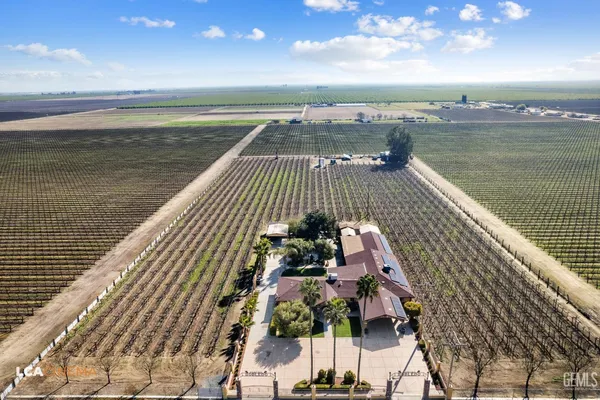 an aerial view of houses with yard