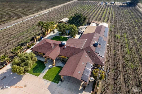 an aerial view of house with yard