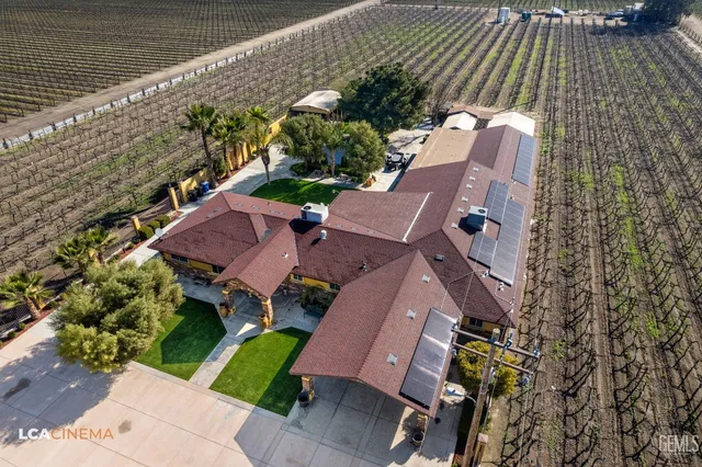 an aerial view of house with yard