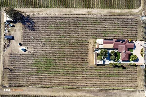 an aerial view of houses with yard