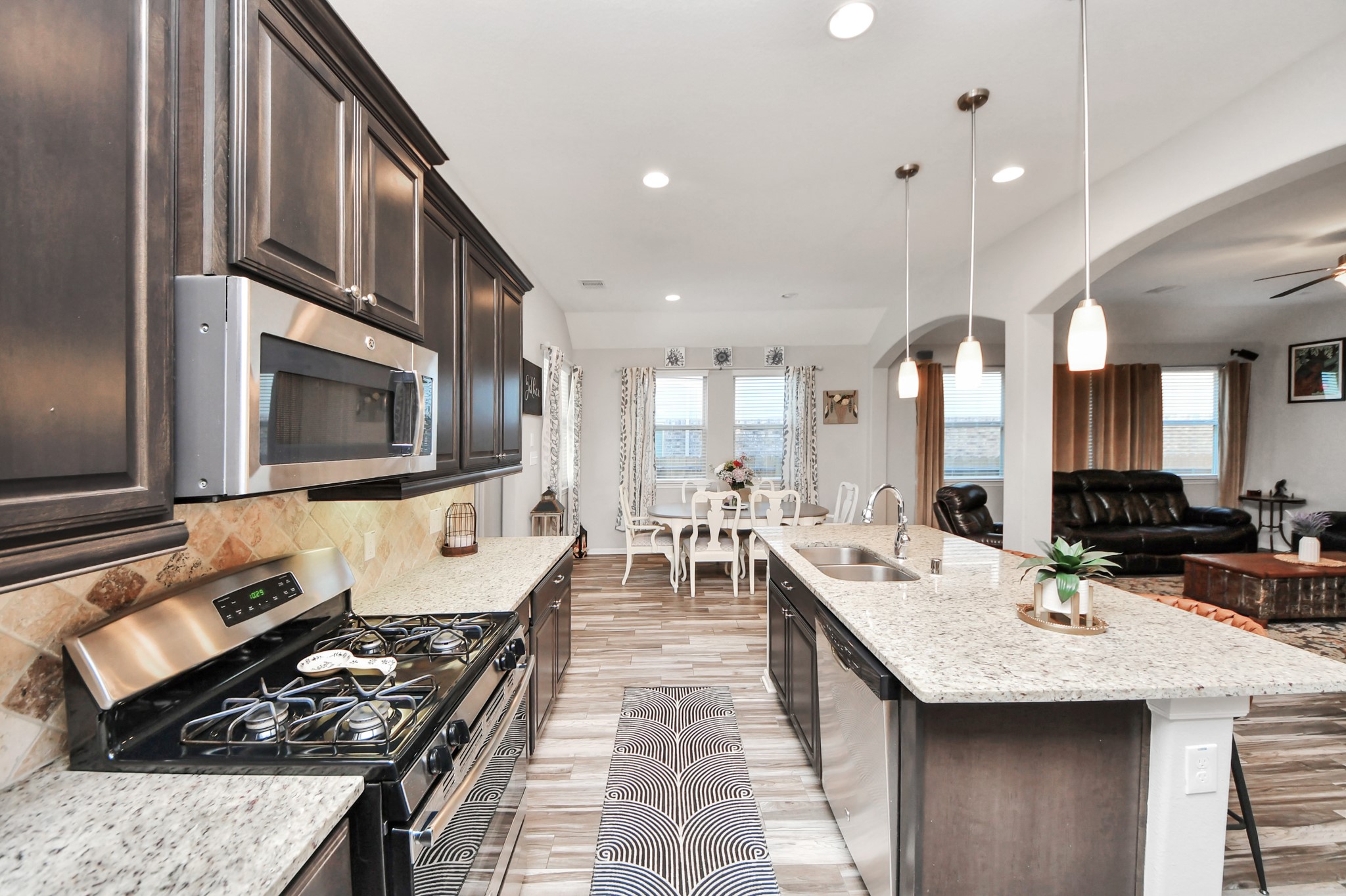 409 Billingsgate Chase, Unit CHASE Conroe, TX 77304 - Photo 5 of 45 Stainless steel appliances, and granite countertops. Plenty of cabinet space gas cooktop