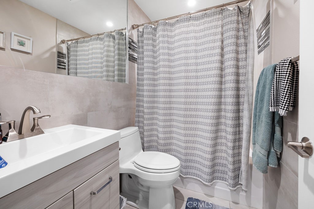 1340 Glenwood Road, Unit 8 Glendale, CA 91201 - Photo 11 of 17 a bathroom with a sink a toilet and shower