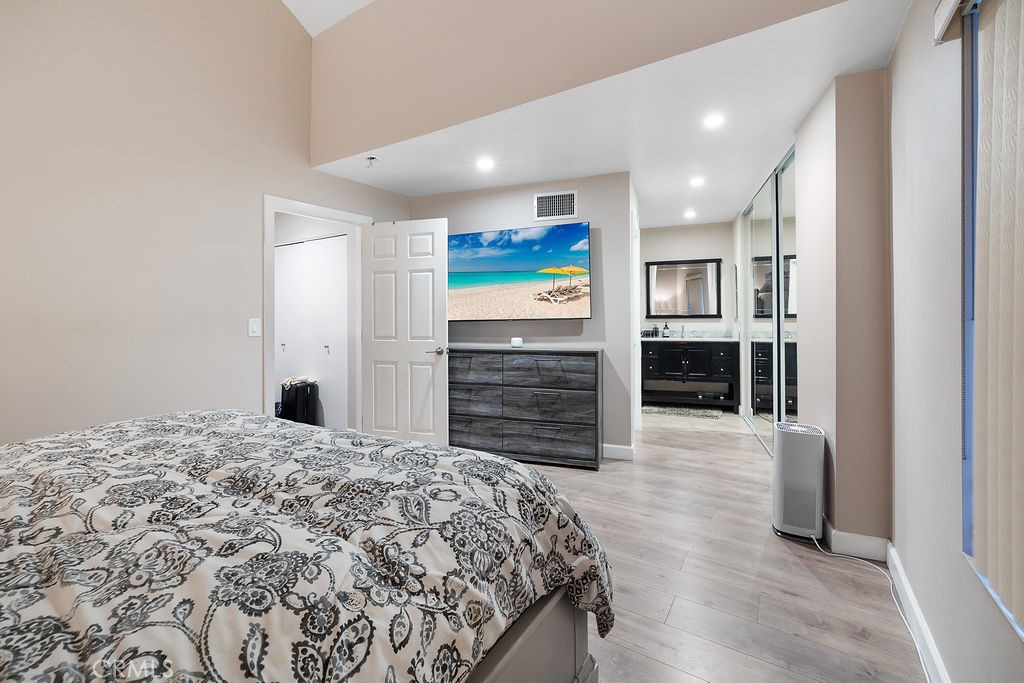 1340 Glenwood Road, Unit 8 Glendale, CA 91201 - Photo 14 of 17 a large bedroom with a bed and cabinets
