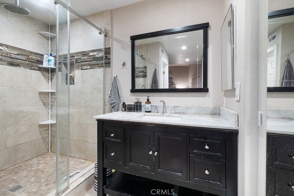 1340 Glenwood Road, Unit 8 Glendale, CA 91201 - Photo 16 of 17 a bathroom with a granite countertop sink mirror and double