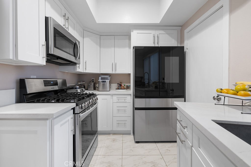 1340 Glenwood Road, Unit 8 Glendale, CA 91201 - Photo 5 of 17 a kitchen with a stove and a microwave