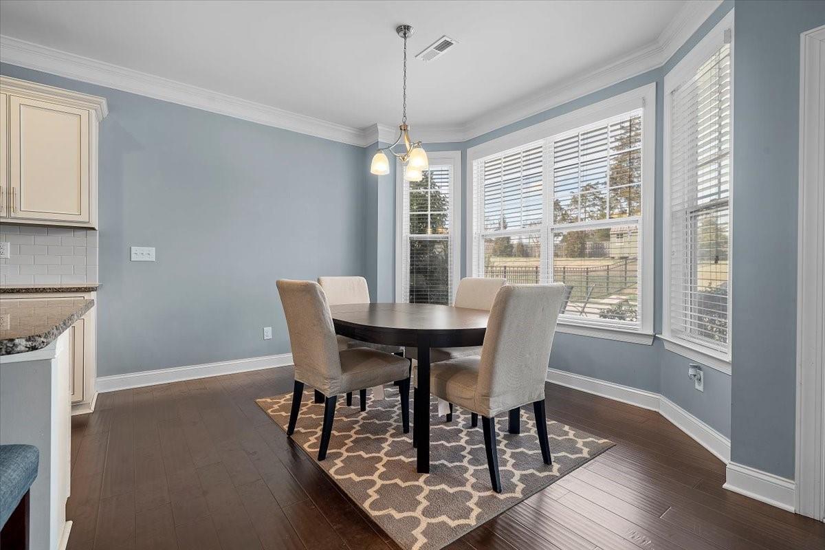 7399 Albemarle Drive Denver, NC 28037 - Photo 14 of 48 a dining room with furniture window and wooden floor