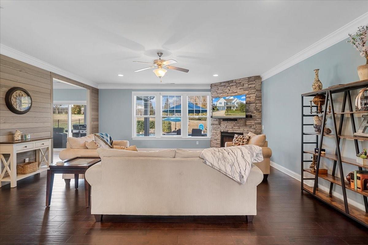7399 Albemarle Drive Denver, NC 28037 - Photo 18 of 48 a living room with furniture and a wooden floor