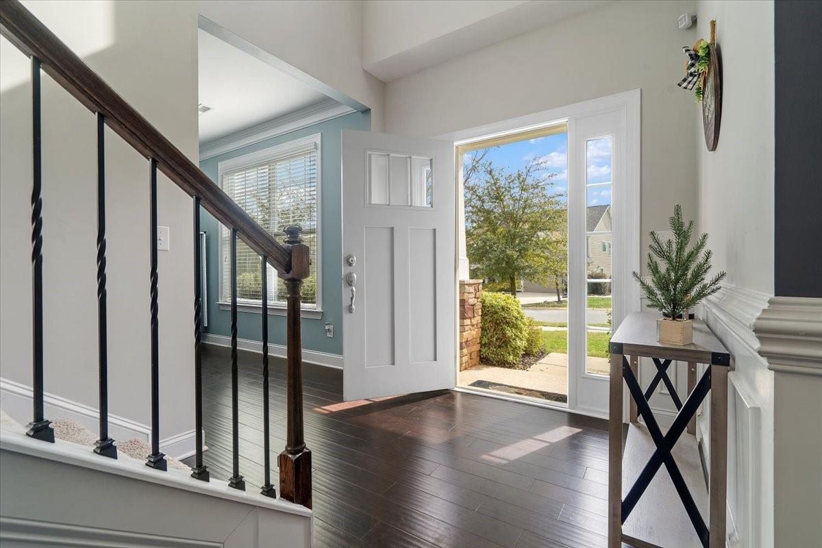 7399 Albemarle Drive Denver, NC 28037 - Photo 2 of 48 a view of an entryway with wooden floor and door