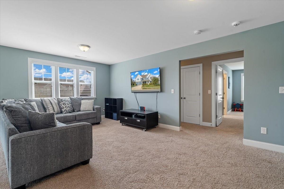 7399 Albemarle Drive Denver, NC 28037 - Photo 22 of 48 a living room with furniture and a window