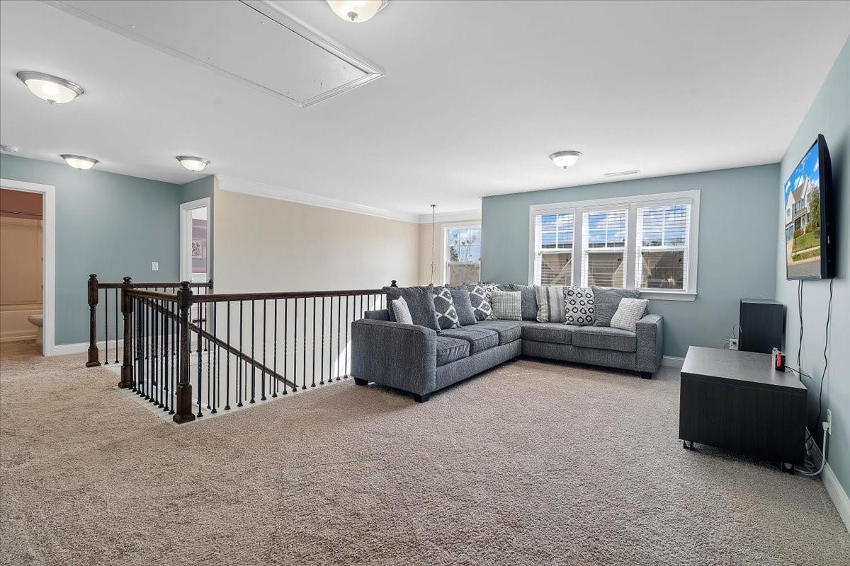 7399 Albemarle Drive Denver, NC 28037 - Photo 23 of 48 a living room with furniture and a flat screen tv