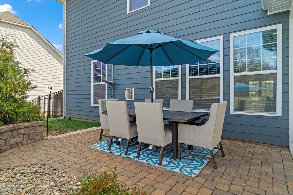 7399 Albemarle Drive Denver, NC 28037 - Photo 41 of 48 a view of a patio with a table chairs and a backyard