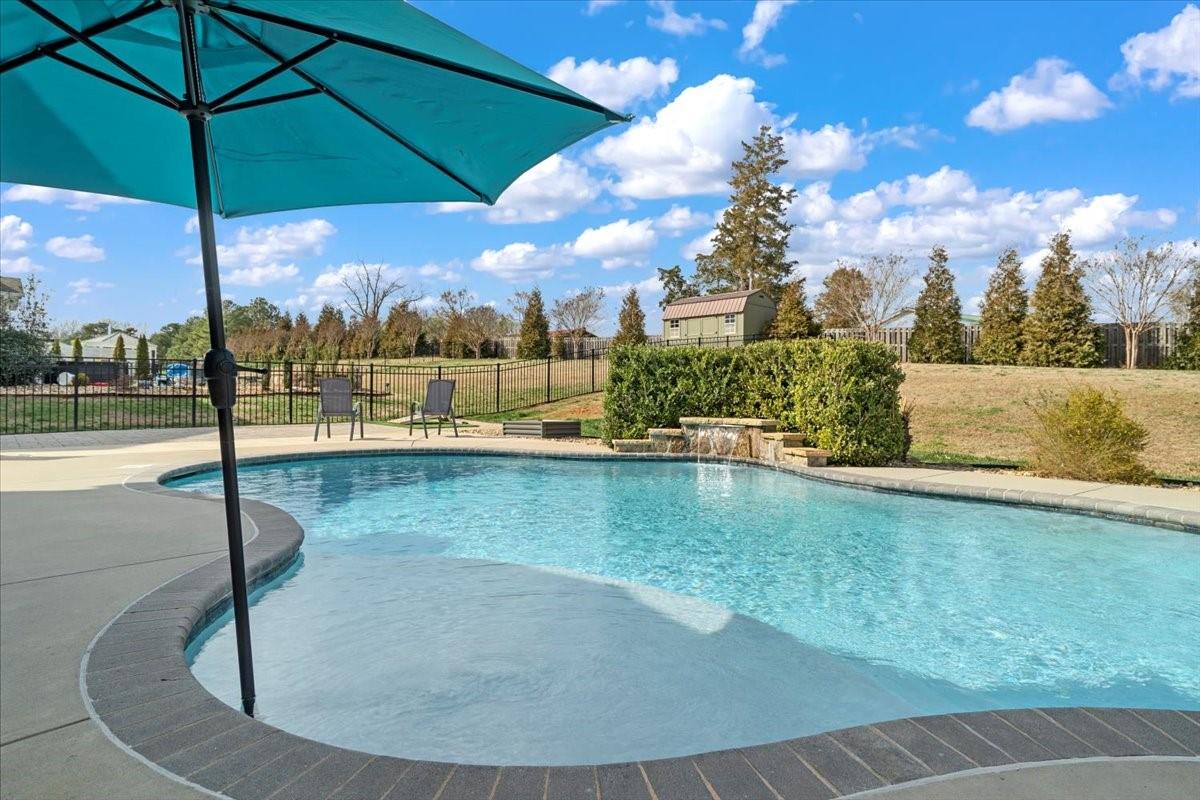 7399 Albemarle Drive Denver, NC 28037 - Photo 44 of 48 a view of a swimming pool with sitting space
