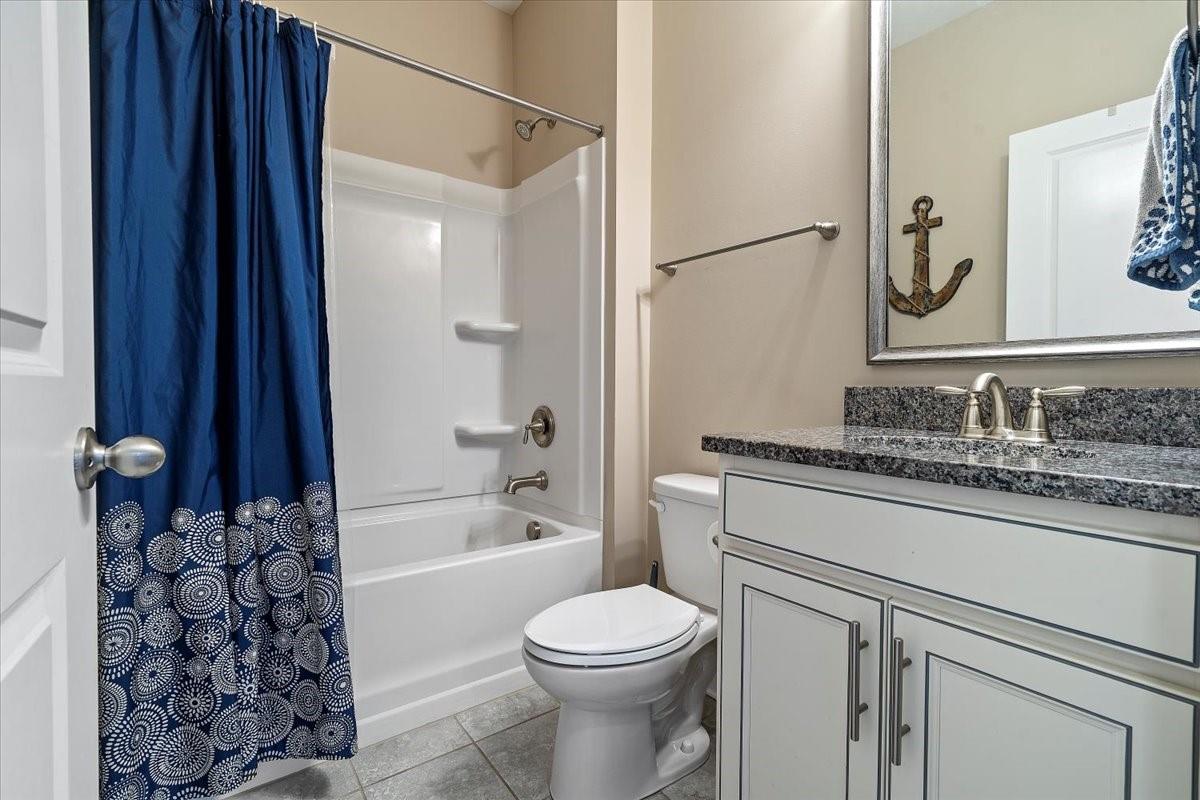 7399 Albemarle Drive Denver, NC 28037 - Photo 7 of 48 a bathroom with a granite countertop sink toilet and shower