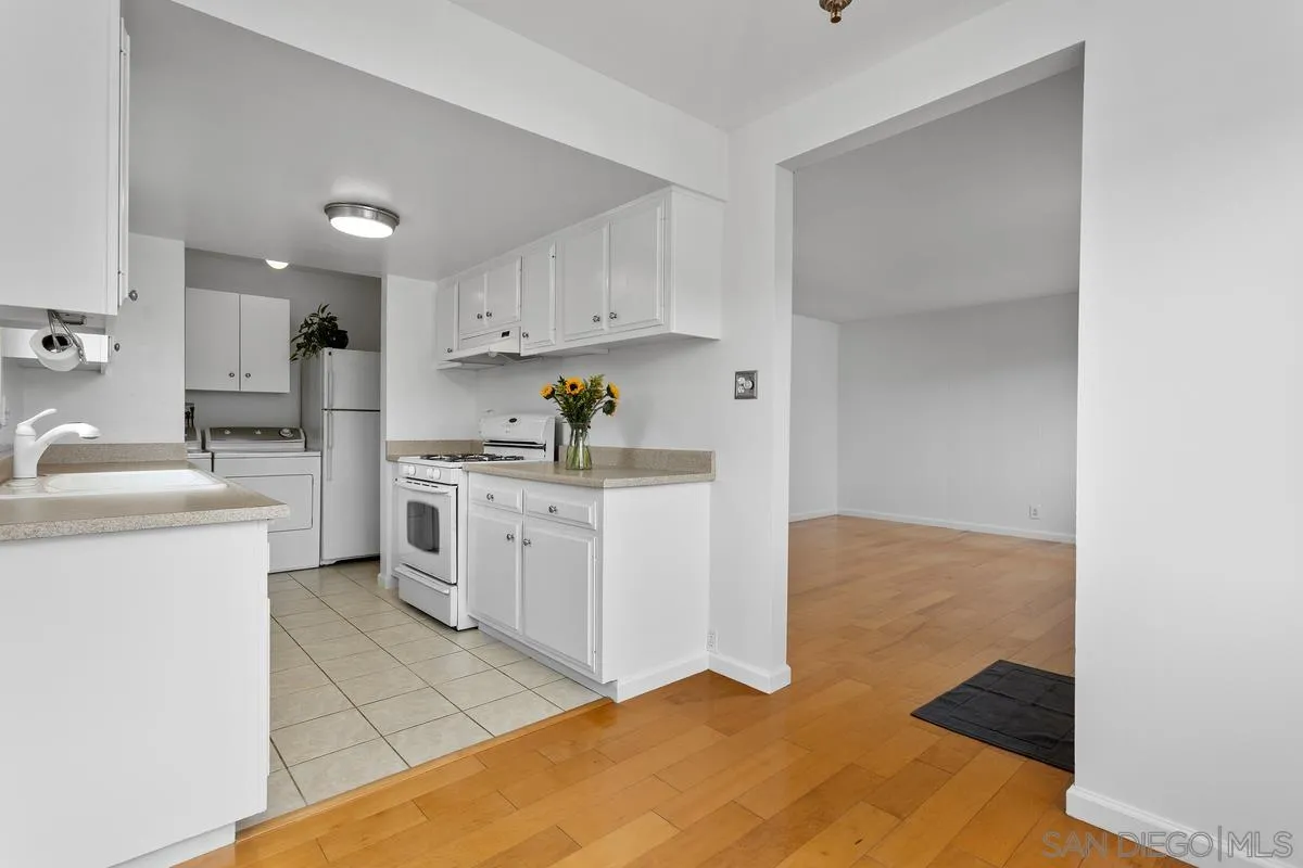 709 Sunflower Street Encinitas, CA 92024 - Photo 15 of 31 a kitchen with a cabinets and appliances