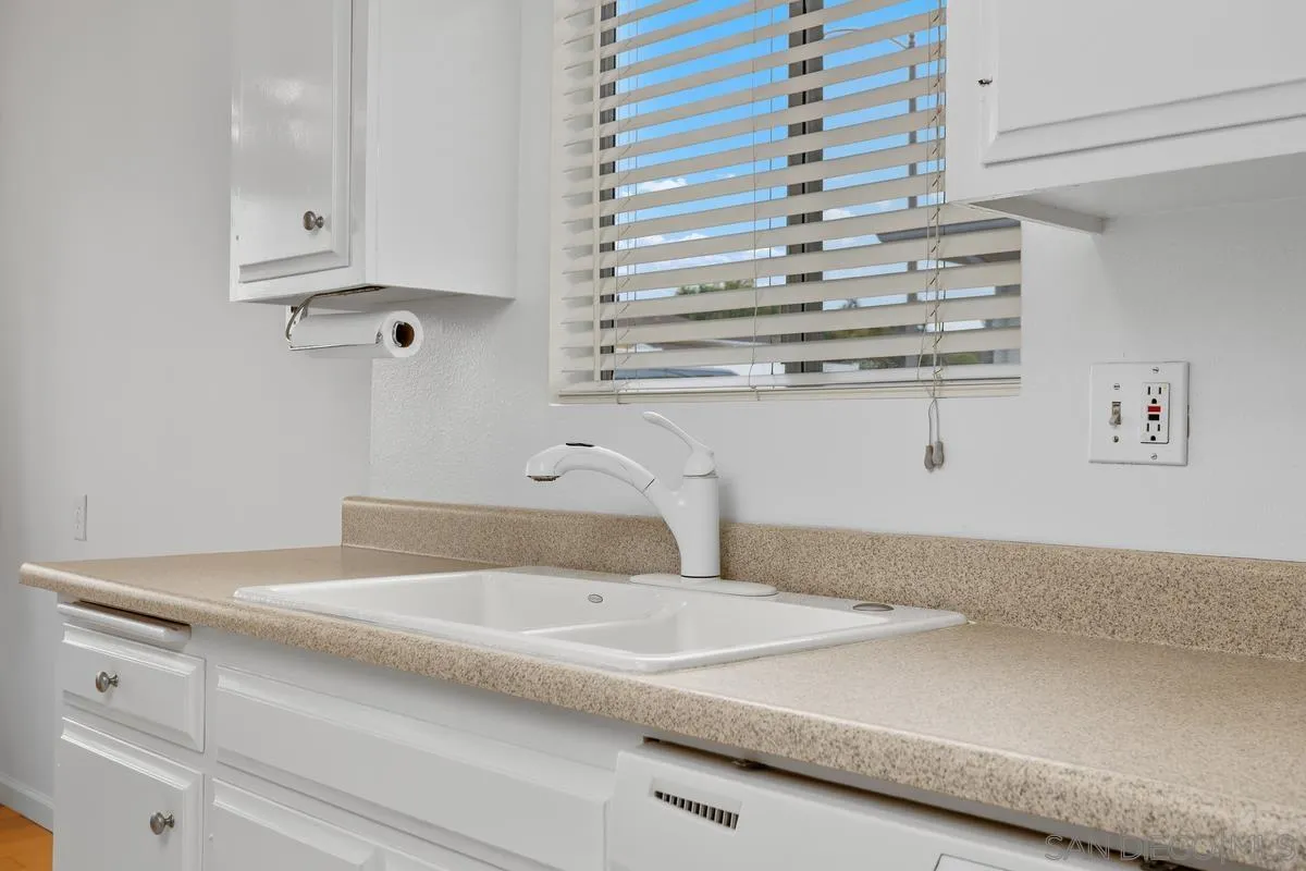 709 Sunflower Street Encinitas, CA 92024 - Photo 19 of 31 a bathroom with a sink and cabinets