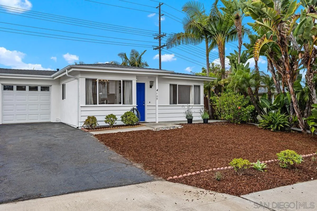 709 Sunflower Street Encinitas, CA 92024 - Photo 2 of 31 a front view of a house with a yard and a garage