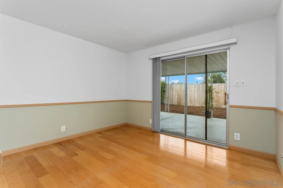 709 Sunflower Street Encinitas, CA 92024 - Photo 22 of 31 an empty room with sliding glass door