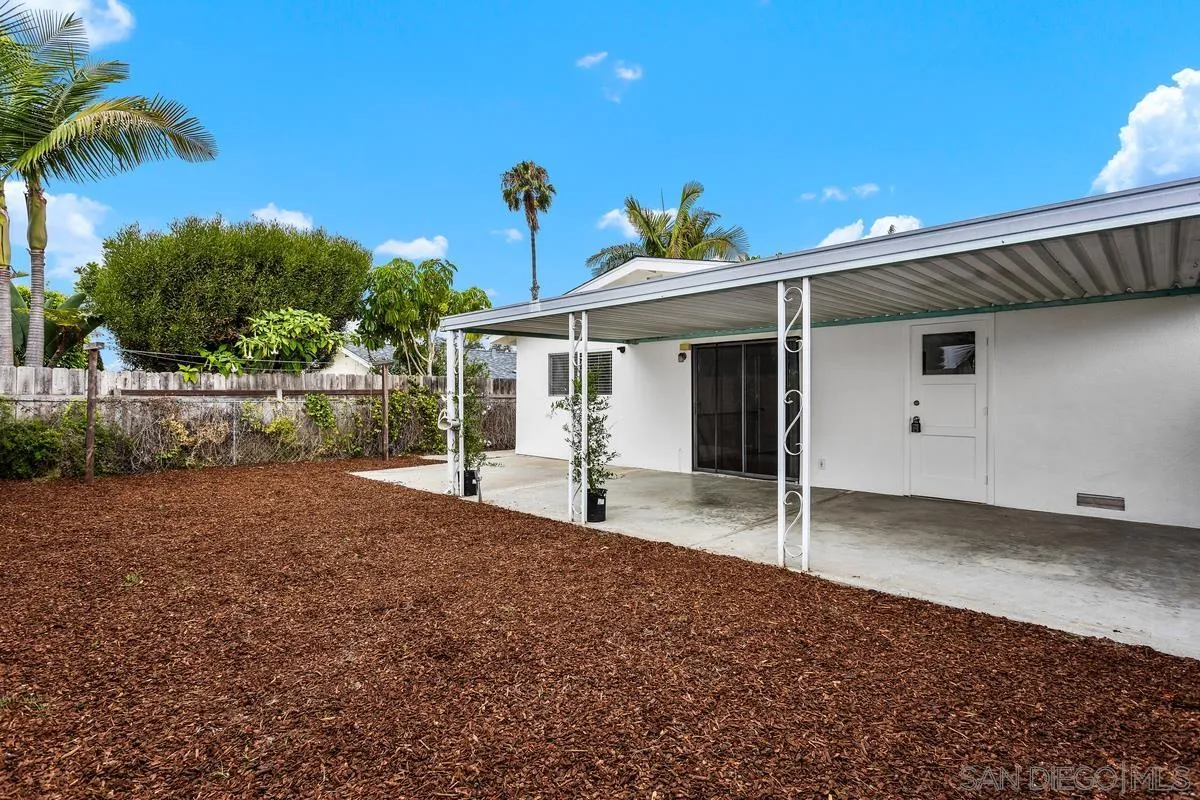 709 Sunflower Street Encinitas, CA 92024 - Photo 31 of 31 a front view of a house with a yard and garage