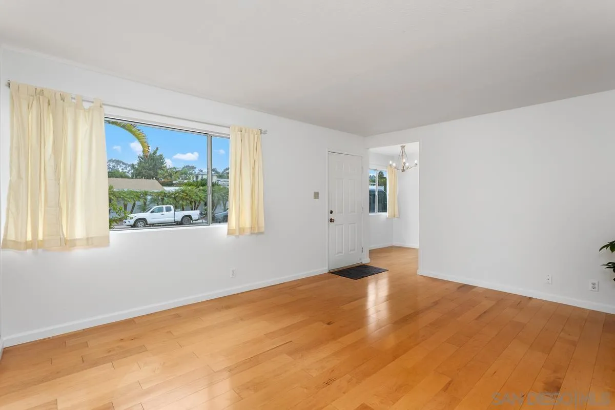 709 Sunflower Street Encinitas, CA 92024 - Photo 10 of 31 a view of empty room with wooden floor and fan