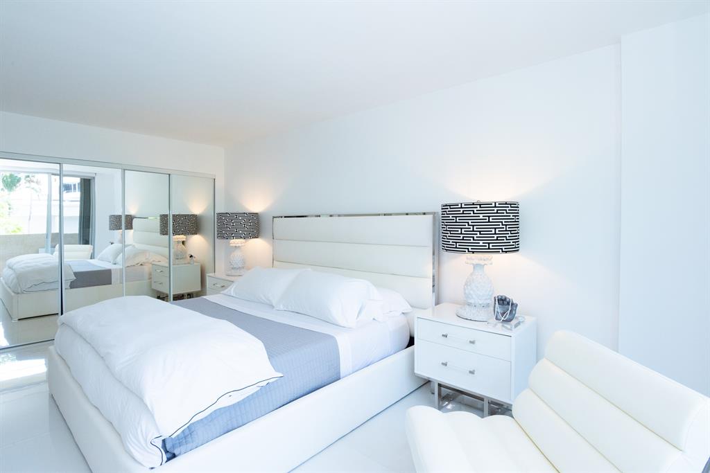 3581 South Ocean Boulevard, Unit 2B Palm Beach, FL 33480 - Photo 20 of 41 a large white bed in a white room