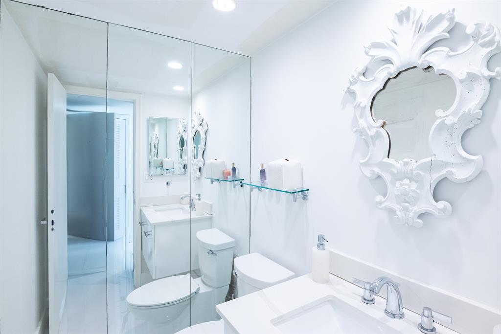 3581 South Ocean Boulevard, Unit 2B Palm Beach, FL 33480 - Photo 24 of 41 a bathroom with a sink toilet and shower