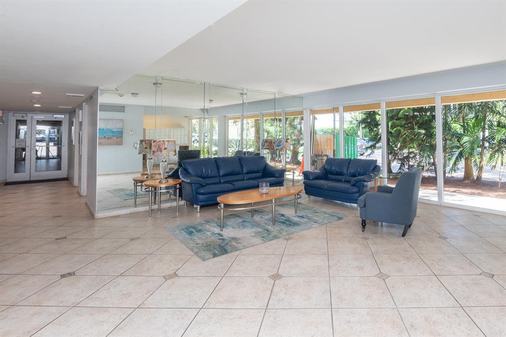 3581 South Ocean Boulevard, Unit 2B Palm Beach, FL 33480 - Photo 31 of 41 a living room with furniture and a large window
