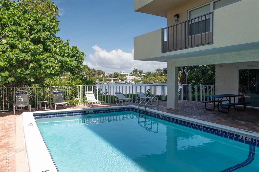 3581 South Ocean Boulevard, Unit 2B Palm Beach, FL 33480 - Photo 37 of 41 a view of a swimming pool with a deck