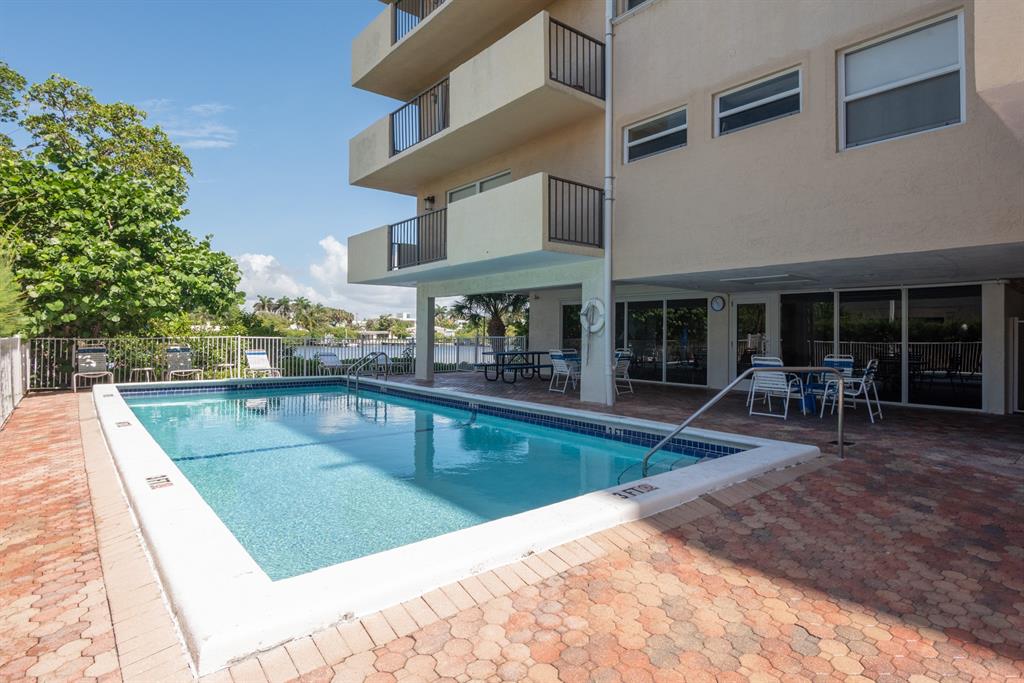 3581 South Ocean Boulevard, Unit 2B Palm Beach, FL 33480 - Photo 38 of 41 a view of a house with swimming pool and sitting area
